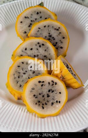 Close up of sliced honey, dragon fruit on a white plate, 2023, United States Stock Photo