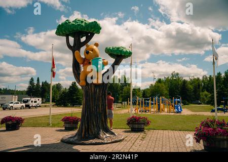 WHITE RIVER, ONTARIO, CANADA - MAY 2023 View of Winnie the Pooh statue in the town of White River. High quality photo Stock Photo