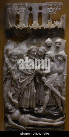 Relief depicting a scene from the Passion of Christ, 15th century. The Kiss of Judas and the Arrest of Christ. Alabaster. From Nottingham Workshops (England). Carmo Archaeological Museum. Lisbon, Portugal. Stock Photo