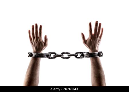 Shackled hands isolated on white background with clipping path Stock Photo