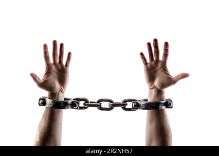 Shackled hands isolated on white background with clipping path Stock Photo