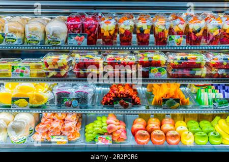 SINGAPORE - MAR 3, 2020: Packages with fresh fruits displayed in a commercial refrigerator Stock Photo