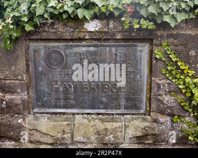 Plaque commemorating the opening of Hay Bridge over the River Wye in January 1958, Hay-on-Wye, Powys, Wales, UK Stock Photo
