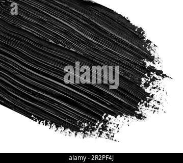 Brushstrokes of black oil paint on white background, closeup Stock Photo