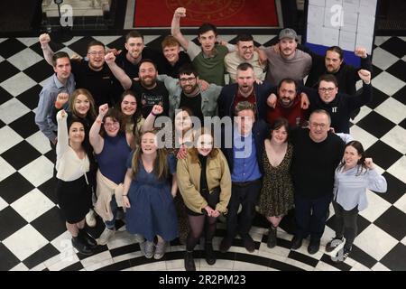 Michael Collins (front centre right) from People Before Profit, who has won the last seat, at Belfast City Hall with supporters and colleagues during the Northern Ireland council elections. Picture date: Saturday May 20, 2023. Stock Photo