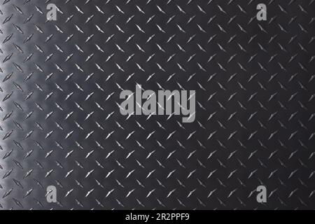 dark metal background, steel texture with diamond print. Stock Photo