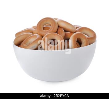 Bowl with tasty dry bagels (sushki) isolated on white Stock Photo