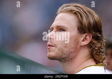 Pittsburgh Pirates center fielder Jack Suwinski looks out of the dugout  before the start of a baseball game against the Miami Marlins, Friday, June  23, 2023, in Miami. (AP Photo/Wilfredo Lee Stock