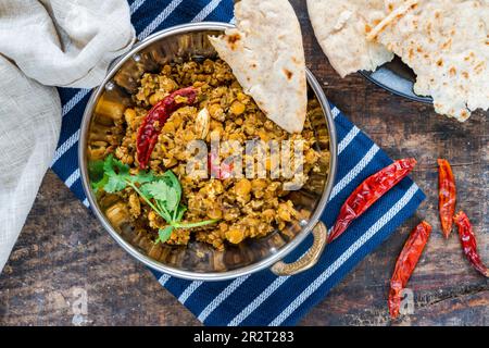 Bengal coconut dal curry with roti Stock Photo - Alamy