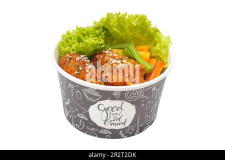 Fried chicken in spicy sauce sprinkled with sesame and chicken katsu with vegetables isolated on white background. fast food concept Stock Photo