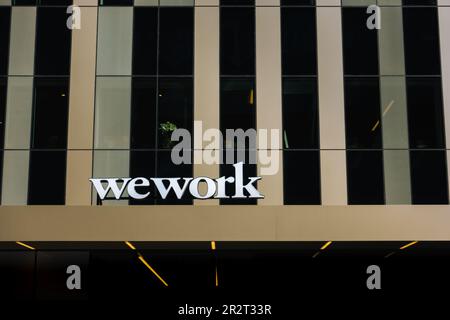 Stockholm, Sweden - 4 May 2023: WeWork logo on modern office building in urban city environment Stock Photo
