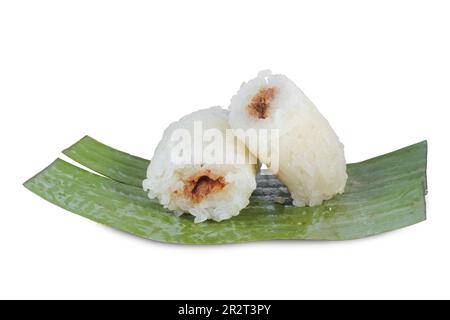 lemper isolated on white background. Indonesian traditional food lemper. Asian culinary lemper. rice cakes with banana leaves and chicken inside Stock Photo