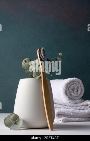 Eco-friendly bamboo toothbrushes in a white holder. Zero waste, plastic free, sustainable lifestyle concept. Stock Photo