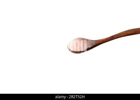 Wooden spoon with Himalayan pink salt. Stock Photo