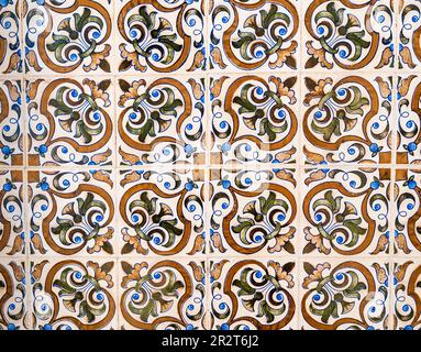 Traditional tiles with floral shapes and pastel colours adorning the facades of the houses in Aveiro, Portugal Stock Photo
