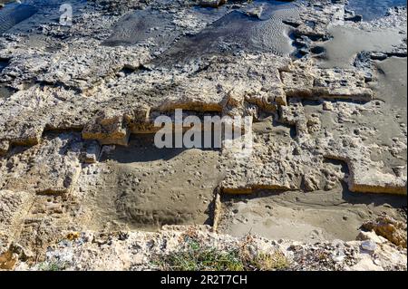 Calp, Alicante, Spain - January 26, 2023: Archaeological site named the Queen's Baths (Spanish: Banos de la Reina) in the coastline. The ancient Roman Stock Photo