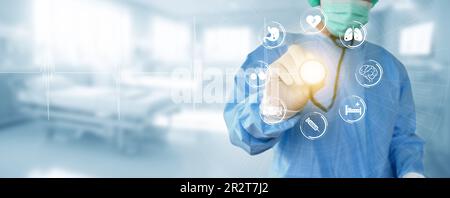 Medicine doctor holds a stethoscope in hand and examines various medical network icons connected through a modern virtual interface technology. Stock Photo