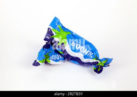 Ho Chi Minh City, Vietnam - May 20, 2023: 2 Bounty mini chocolate bars empty crumpled wrappers isolated on white. Popular blue candy packaging with a Stock Photo