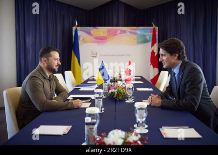 Hiroshima, Japan. 21st May, 2023. Ukraine's President Volodymyr Zelensky (L), meets with Canadian Prime Minister Justin Trudeau on Sunday, May 21, 2023, on the final day of a three-day G-7 summit in Hiroshima, Japan. The final day of the three-day of the Group of Seven leaders' summit is under way in the western Japan city of Hiroshima, with focus on Ukrainian President Volodymyr Zelensky and his talks with international leaders. Photo by Ukrainian President Press Office/ Credit: UPI/Alamy Live News Stock Photo