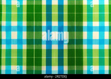 The texture of linen fabric in a large green cell. Scottish tailoring material Stock Photo