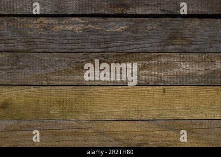Old, raw boards arranged in a row. Raw wood texture. Stock Photo