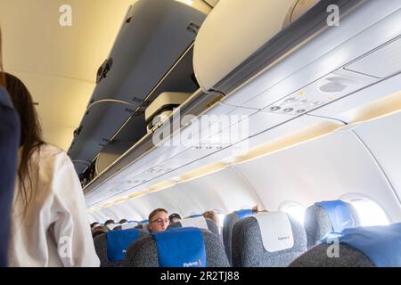 Passengers boarding Airbus A320 airplane operated by Fly Arna. back ...