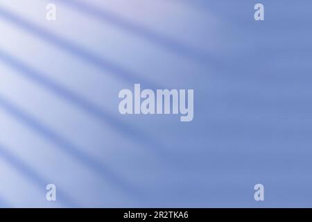 Abstract blue backgrounds with sun rays and shadow on the wall Stock Photo