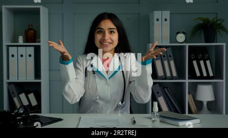 Happy doctor young woman therapist general practitioner psychologist talk at webcam consult patient distant give professional medical good Stock Photo