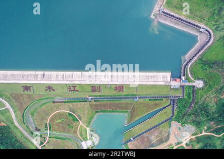 Guiping, China. 20th May, 2023. (230521) -- GUIPING, May 21, 2023 (Xinhua) -- This aerial photo shows the nature-imitated fishway of the auxiliary dam in Nanmu River, which is part of the Dateng Gorge water conservancy project in Guiping City, south China's Guangxi Zhuang Autonomous Region, May 20, 2023. Dateng Gorge water conservancy project is under construction on a section of Qianjiang River in Guiping, south China's Guangxi, where is an important spawning field for migration fishes in Zhujiang River basin. In order to protect fishes and the biodiversity of aquatic life in the Zhujiang Riv Stock Photo