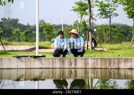 Guiping, China. 20th May, 2023. (230521) -- GUIPING, May 21, 2023 (Xinhua) -- Technicians conduct water quality monitor at a fish propagation station of the Dateng Gorge water conservancy project in Guiping City, south China's Guangxi Zhuang Autonomous Region, May 20, 2023. Dateng Gorge water conservancy project is under construction on a section of Qianjiang River in Guiping, south China's Guangxi, where is an important spawning field for migration fishes in Zhujiang River basin. In order to protect fishes and the biodiversity of aquatic life in the Zhujiang River basin, minimize the influenc Stock Photo