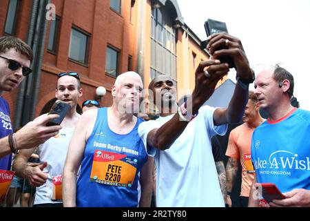 Sir Mo Farah poses with fans at the finish line of the 10k mens elite race during the AJ Bell Great Manchester Run 2023. Picture date: Sunday May 21, 2023. Stock Photo