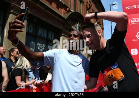 Sir Mo Farah poses with fans at the finish line of the 10k mens elite race during the AJ Bell Great Manchester Run 2023. Picture date: Sunday May 21, 2023. Stock Photo