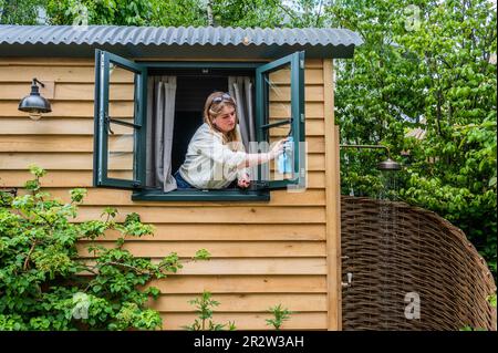London, UK. 21st May, 2023. Final cleaning of the Hannam and Taylor Shepherds huts - The 2023 Chelsea Flower Show. Credit: Guy Bell/Alamy Live News Stock Photo