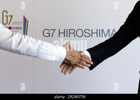 Hiroshima, Japan. 21st May, 2023. Britain's Prime Minister Rishi Sunak (R) shake hands with Indian Prime Minister Narendra Modi as he attends the G7 Summit on Sunday, May 21, 2023, during the final day of a three-day G-7 summit in Hiroshima, Japan. The final day of the three-day of the Group of Seven leaders' summit is under way in the western Japan city of Hiroshima, with focus on Ukrainian President Volodymyr Zelensky and his talks with international leaders. Photo by Simon Dawson/No 10 Downing Street/ Credit: UPI/Alamy Live News Stock Photo