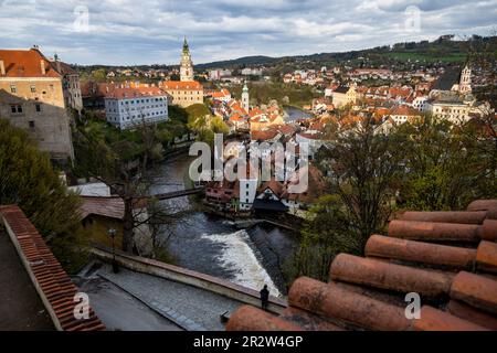 View from wall upstairs, historical centre and castle in Cesky Krumlov at sunset. South Bohemia. Stock Photo