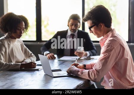 Multiracial Group Of Happy Businesspeople Sitting Together In Row ...