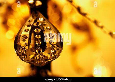 one crystal with gold and yellow bokeh of lighting for background and inspiration Stock Photo
