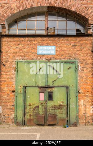 Poland, Gdansk, Imperial Shipyard - 01 May 2019: High gate of abandoned destroyed hall. The Imperial Shipyard Trail, Gdansk Shipyard, Poland Stock Photo