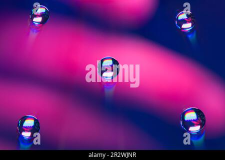 Waterdrops on a CD with color light Stock Photo