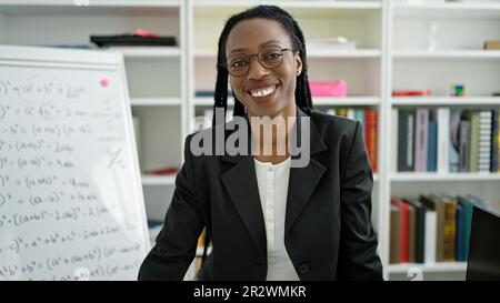 African american woman teacher smiling confident standing at university classroom Stock Photo