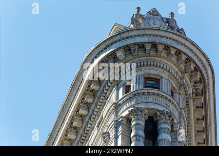 Flatiron Building is a NYC icon, distinctive for its rich terra cotta ornamentation as well as its triangular shape. Stock Photo