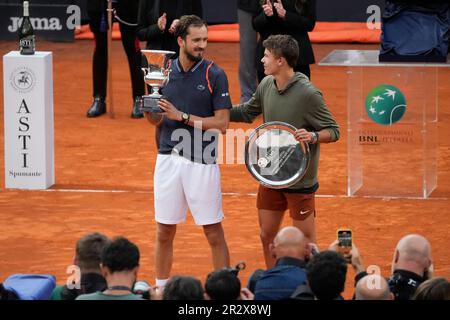 Daniil Medvedev of Russia, right, poses after winning the final