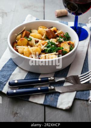 Gnocchi with Vegan Sausage, Kale and Sun-dried Tomatoes Stock Photo