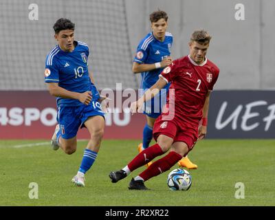 Budapest, Hungary. 21st May, 2023. Marco Romano of Italy challenges Uros Cuk of Serbia during the UEFA European Under-17 Championship 2023 Group B match between Serbia and Italy at Hidegkuti Nandor Stadium on May 21, 2023 in Budapest, Hungary. Credit: Laszlo Szirtesi/Alamy Live News Stock Photo