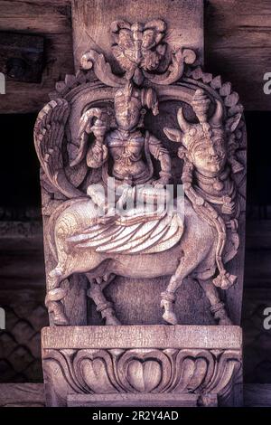 Goddess Meenakshi sitting on Kamadhenu Vahana carrier vehicle, 17th century wooden carvings in Meenakshi-Sundareswarar temple Chariot at Madurai Stock Photo