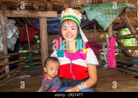 Long-necked woman with her baby, Karen tribe, Chiang Mai, Thailand Stock Photo