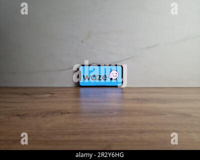 Konskie, Poland - May 20, 2023: Waze GPS navigation app logo displayed on mobile phone screen Stock Photo