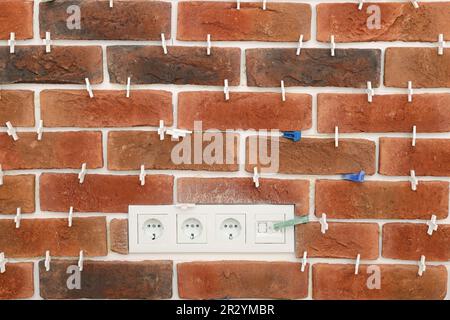 Decorative bricks with tile leveling system on wall Stock Photo