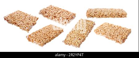 Many puffed rice bars (kozinaki) on white background, banner design Stock Photo
