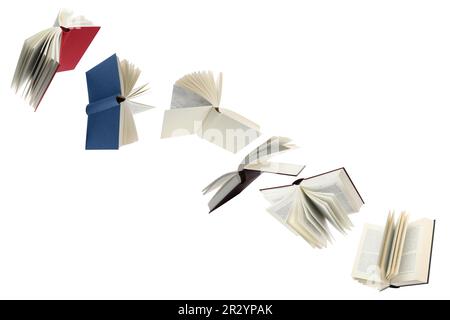 Many hardcover books flying on white background Stock Photo